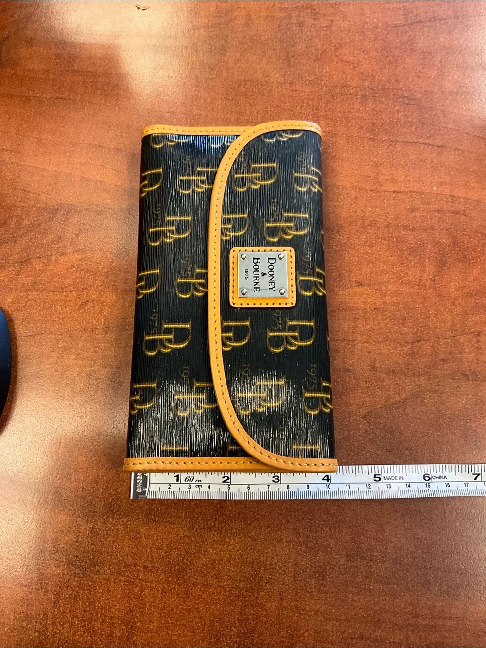 Dooney & Bourke Black Wallet with Yellow Trim and Logo Plaque